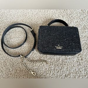 Kate Spade Maisie Laurel Way Glitter bag with shoulder strap.